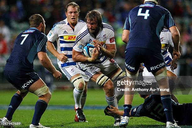 Andries Bekker of the Stormers charges at Luke Braid of the Blues during the round 12 Super Rugby match between the Blues and the Stormers at North...
