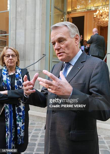 French Prime minister Jean-Marc Ayrault speaks in front of the Maison de l’Amérique Latine as Marylise Lebranchu, the minister of State Reform,...