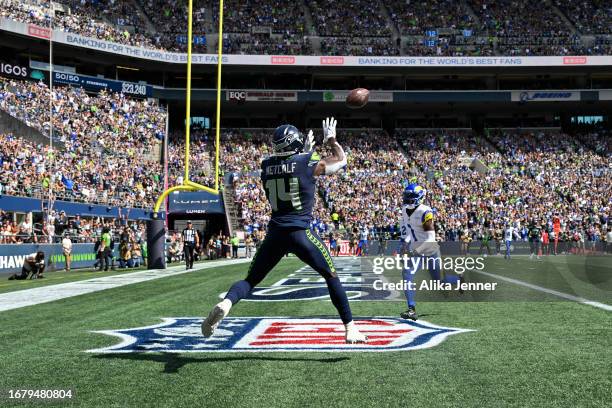 Metcalf of the Seattle Seahawks catches the ball in the end zone against Derion Kendrick of the Los Angeles Rams during the game at Lumen Field on...