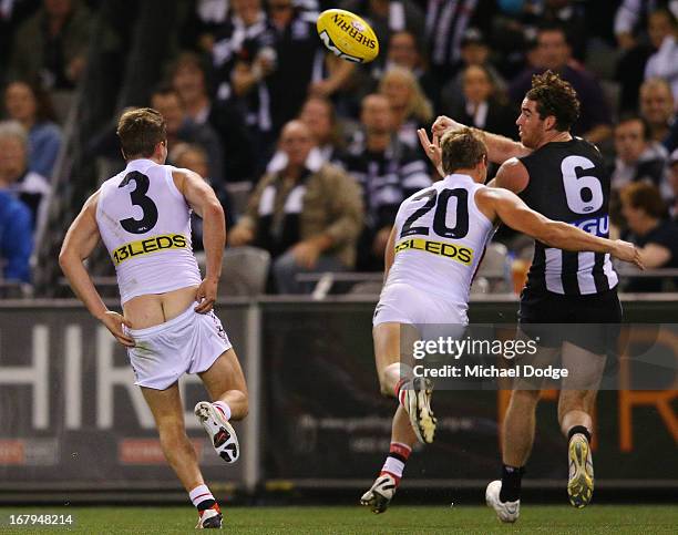 Jack Steven of the Saints chases Tyson Goldsack of the Magpies with his pants down during the round six AFL match between the Collingwood Magpies and...