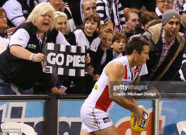 Stephen Milne of the Saints cops some abuse from Magpies fans while lining up for goal during the round six AFL match between the Collingwood Magpies...