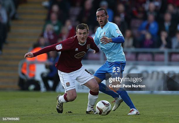 Lee Collins of Northampton Town moves away with the ball as Kaid Mohamed of Cheltenham Town looks on during the npower League Two Play Off Semi Final...