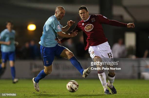 Ben Tozer of Northampton Town contests the ball with Russell Penn of Cheltenham Town during the npower League Two Play Off Semi Final 1st leg match...