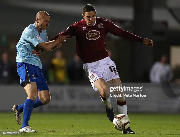 Ben Tozer of Northampton Town contests the ball with Russell Penn of Cheltenham Town during the npower League Two Play Off Semi Final 1st leg match...