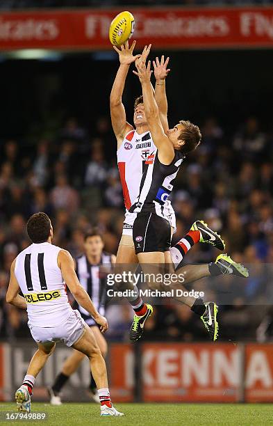 Arryn Siposs of the Saints contests for the ball against Ben Kennedy of the Magpies during the round six AFL match between the Collingwood Magpies...