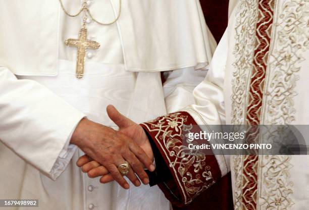 Pope Benedict XVI shakes hands with Ali Bardakoglu, secular Turkey's top religious official, at the Directorate of Religious Affair in Ankara 28...