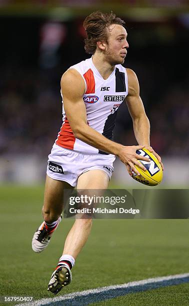 Josh Saunders of the Saints runs with the ball during the round six AFL match between the Collingwood Magpies and the St Kilda Saints at Etihad...