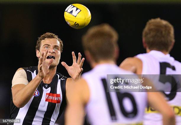 Jarrod Witts of the Magpies marks the ball during the round six AFL match between the Collingwood Magpies and the St Kilda Saints at Etihad Stadium...