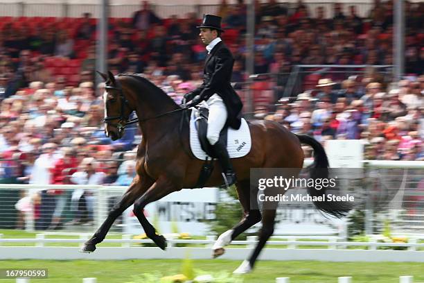 Harry Meade of Great Britain rides Wild Lone during the dressage section of the Badminton Horse Trials on May 3, 2013 in Badminton, Gloucestershire.