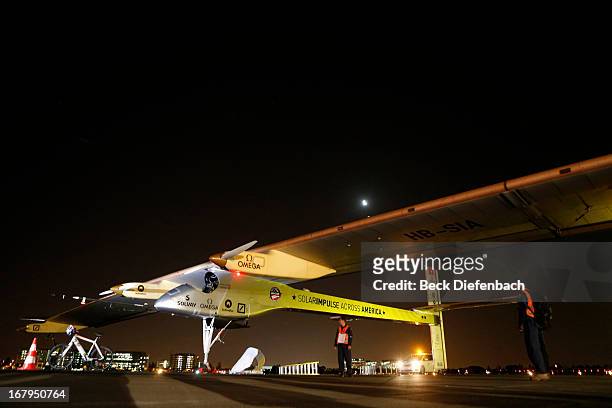 The Solar Impulse solar electric airplane sits on on the runway at Moffett Field before flying to Pheonix, Arizona, as part of a cross-country trip...