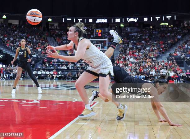 Marina Mabrey of the Chicago Sky tries to secure the ball after blocking a shot by Kelsey Plum of the Las Vegas Aces in the third quarter of Game One...