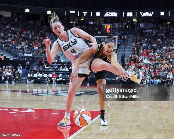 Marina Mabrey of the Chicago Sky tries to secure the ball after blocking a shot by Kelsey Plum of the Las Vegas Aces in the third quarter of Game One...