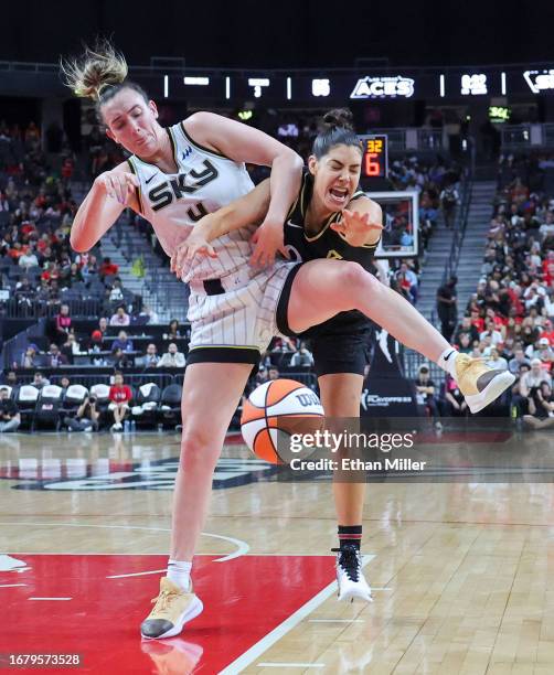 Marina Mabrey of the Chicago Sky tries to secure the ball after blocking a shot by Kelsey Plum of the Las Vegas Aces in the third quarter of Game One...