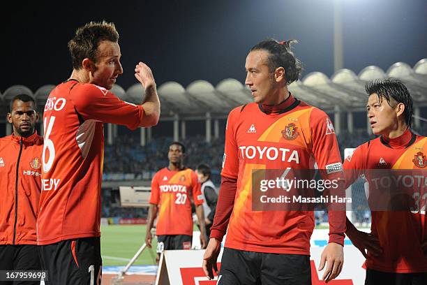 Joshua Kennedy of Nagoya Grampus speaks with Marcus Tulio Tanaka after the J.League match between Kawasaki Frontale and Nagoya Grampus at Todoroki...