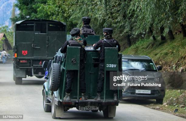 September 19 Srinagar Kashmir, India : Indian Army soldiers leave the site of gun-battles in Gadole village of Kokernag in Anantnag district. So far,...