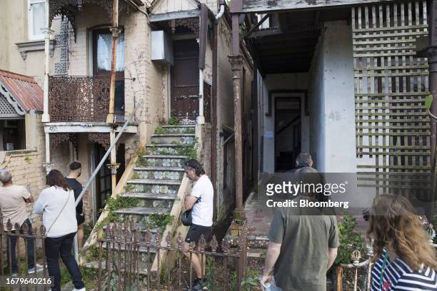 Potential buyers inspect a house before a house auction in Sydney, Australia, on Saturday, August 12, 2023. Less than 1% of the country's rental...