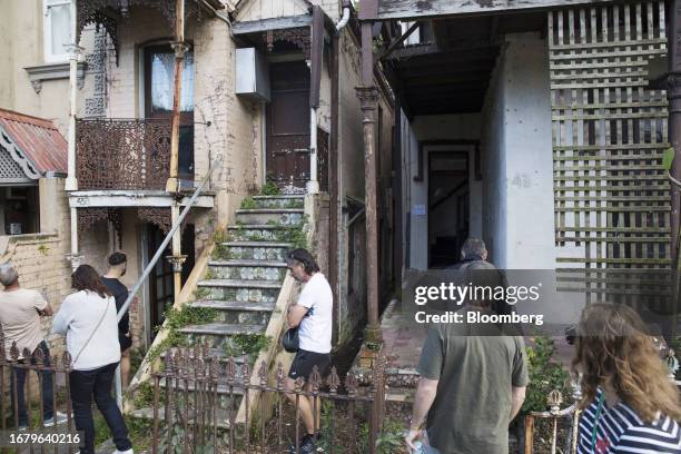 Potential buyers inspect a house before a house auction in Sydney, Australia, on Saturday, August 12, 2023. Less than 1% of the country's rental...