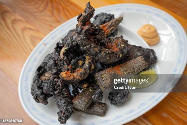deep fried seafood with squid, cuttle ink black batter - dark fruit ink stock pictures, royalty-free photos & images