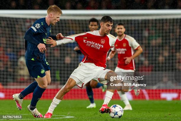 Kai Havertz of Arsenal battles for the ball with Jerdy Schouten of PSV during the UEFA Champions League Group B match between Arsenal and PSV at...