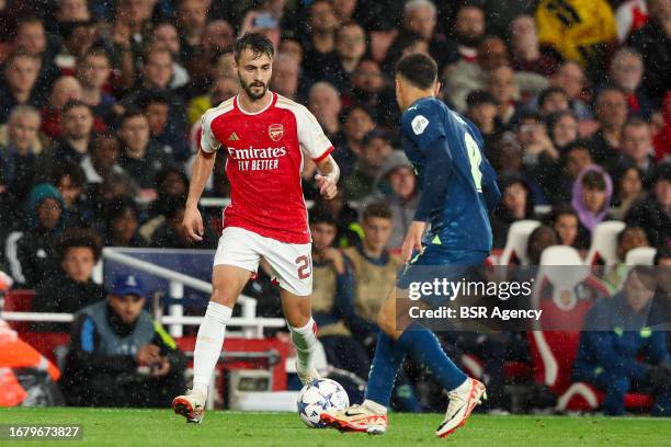 Fabio Vieira of Arsenal is challenged by Sergino Dest of PSV during the UEFA Champions League Group B match between Arsenal and PSV at Emirates...