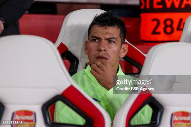 Hirving Lozano of PSV, Yorbe Vertessen of PSV on the bench during the UEFA Champions League Group B match between Arsenal and PSV at Emirates Stadion...