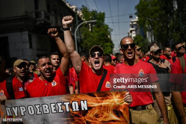Firefighters take part in a demonstration against the government's labour reforms in front of the Greek Parliament in Athens on September 21, 2023....