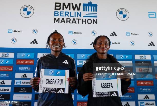 Kenya's Sheila Chepkirui and Ethiopia's Tigist Assefa pose for a photo at a press conference on September 21, 2023 in Berlin, during the presentation...