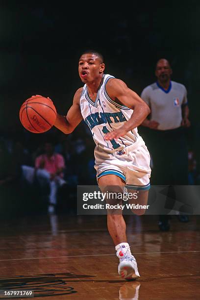 Muggsy Bogues of the Charlotte Hornets dribbles the ball against the Atlanta Hawks during a game played on March 20, 1992 at the Charlotte Coliseum...