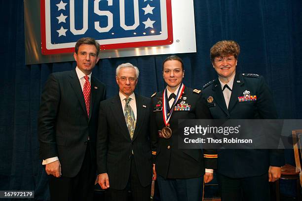 Brian C. Whiting, president and CEO of USO of Metropolitan New York, colonel Jack H. Jacobs, United States Army and medal of honor recipient, captain...