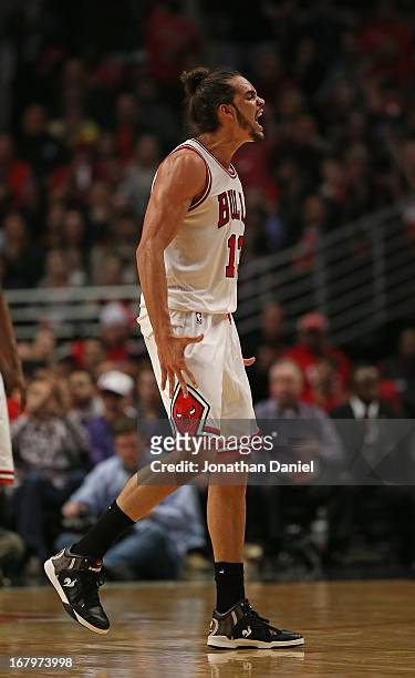 Joakim Noah of the Chicago Bulls yells after hitting a shot and getting fouled against the Brooklyn Nets in Game Six of the Eastern Conference...