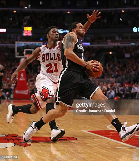 Deron Williams of the Brooklyn Nets drives past Jimmy Butler of the Chicago Bulls in Game Six of the Eastern Conference Quarterfinals during the 2013...