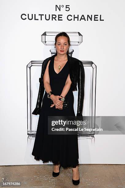 Harumi Klossowska poses during a photocall for 'N°5 Culture Chanel' exhibition at Palais De Tokyo on May 3, 2013 in Paris, France.