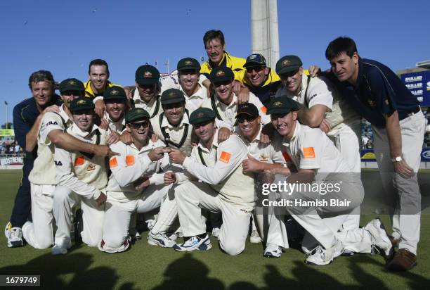 Australia team celebrate with a replica urn after winning the match to retain The Ashes with an unbeatable 3 - 0 lead in the series on day three of...