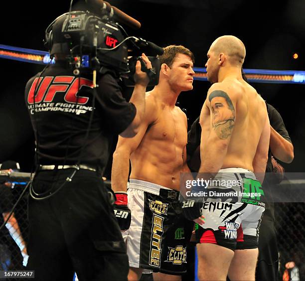 Michael Bisping andAlan Belcher face off at the center of the octagon before a middleweight bout during UFC 159 Jones v. Sonnen at Prudential Center...