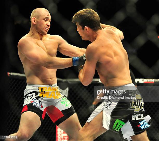 Michael Bisping throws a punch to the face of Alan Belcher during a middleweight bout during UFC 159 Jones v. Sonnen at Prudential Center in Newark,...