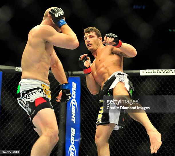 Michael Bisping kicks Alan Belcher during a middleweight bout during UFC 159 Jones v. Sonnen at Prudential Center in Newark, New Jersey.
