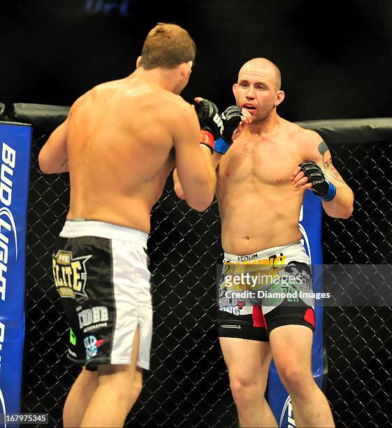 Alan Belcher looks for an opening to throw a punch at Michael Bisping during UFC 159 Jones v. Sonnen at Prudential Center in Newark, New Jersey.