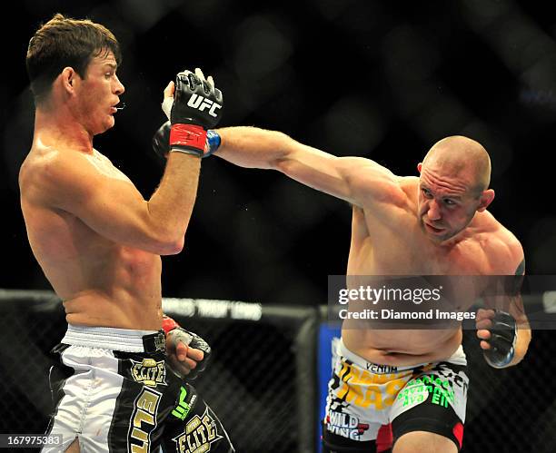 Alan Belcher throws a punch at Michael Bisping during a middleweight bout during UFC 159 Jones v. Sonnen at Prudential Center in Newark, New Jersey.