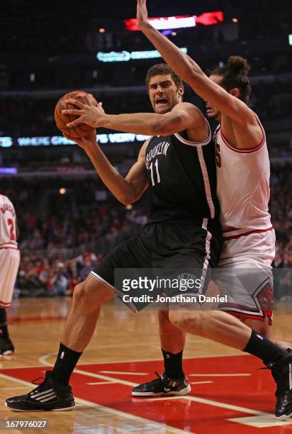 Brook Lopez of the Brooklyn Nets moves against Joakim Noah of the Chicago Bulls in Game Six of the Eastern Conference Quarterfinals during the 2013...