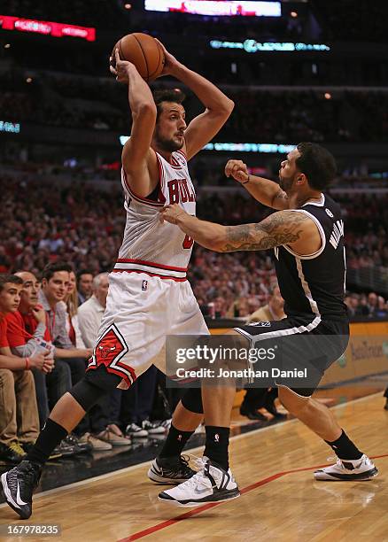 Marco Belinelli of the Chicago Bulls looks to pass over Deron Williams of the Brooklyn Nets in Game Six of the Eastern Conference Quarterfinals...