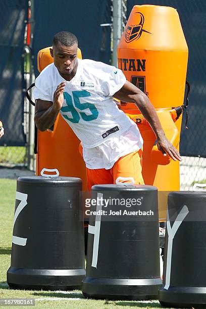 Dion Jordan of the Miami Dolphins runs through drills during the rookie camp on May 3, 2013 at the Miami Dolphins training facility in Davie, Florida.