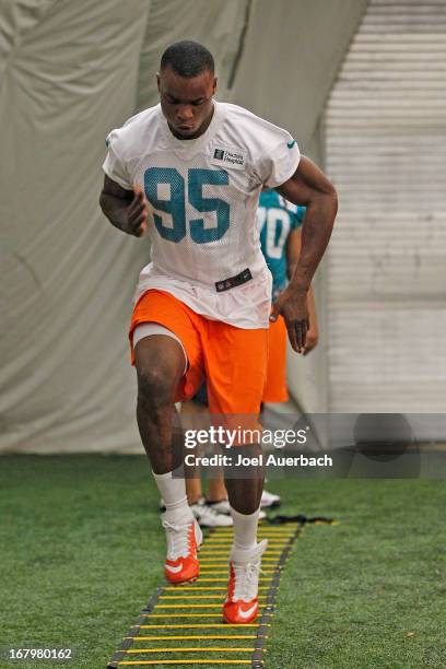 Dion Jordan of the Miami Dolphins works out during the rookie camp on May 3, 2013 at the Miami Dolphins training facility in Davie, Florida.