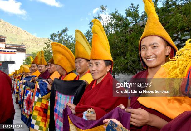Tibetan monks welcome the 11th Panchen Lama Bainqen Erdini Qoigyijabu at the Tashilhunpo Monastery, the traditional seat of the Panchen Lama lineage,...