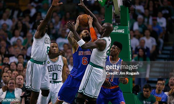 Kevin Garnett of the Boston Celtics tries to block Tyson Chandler of the New York Knicks during Game Six of the Eastern Conference Quarterfinals of...