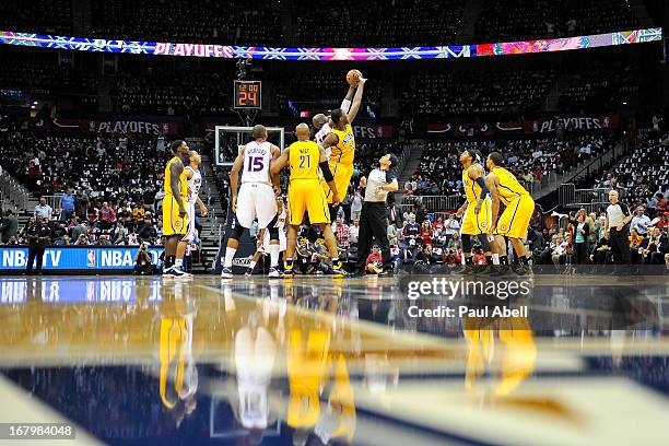 Johan Petro of the Atlanta Hawks and Roy Hibbert of the Indiana Pacers tip off the game at Philips Arena on May 3, 2013 in Atlanta, Georgia. NOTE TO...