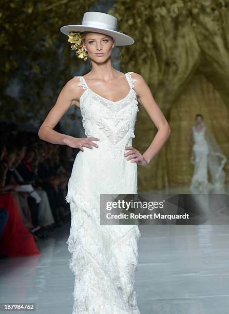 Model walks the runway for the Pronovias bridal fashion show during Barcelona Bridal Week 2013 on May 3, 2013 in Barcelona, Spain.