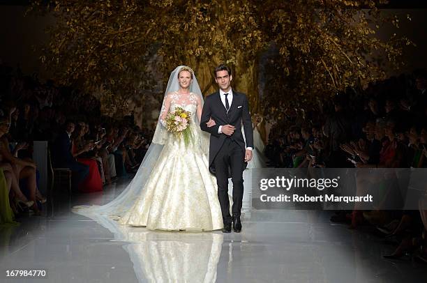 Anne Vyalitsyna and Jon Kortajarena walk the runway for the Pronovias bridal fashion show during Barcelona Bridal Week 2013 on May 3, 2013 in...