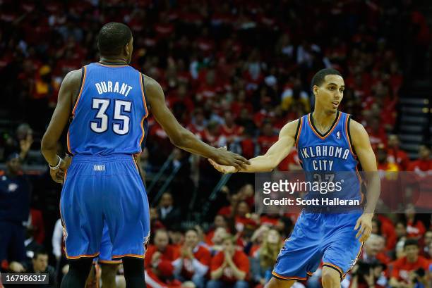 Kevin Durant and Kevin Martin of the Oklahoma City Thunder celebrate a play during the game against the Houston Rockets in Game Six of the Western...