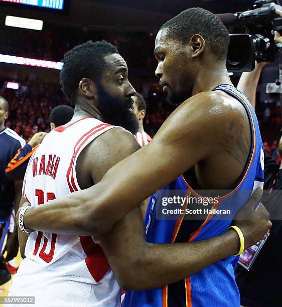 Kevin Durant of the Oklahoma City Thunder hugs James Harden of the Houston Rockets after the Thunder defeated the Rockets 103-94 in Game Six of the...