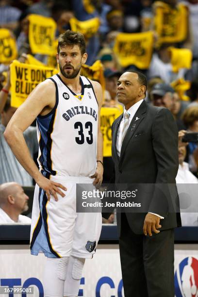 Head coach Lionel Hollins of the Memphis Grizzlies talks with Marc Gasol during Game Six of the Western Conference Quarterfinals of the 2013 NBA...